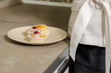 Cupcakes on a plate that is placed on the countertop.