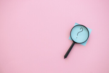 magnifying glass on pink background. Search concept