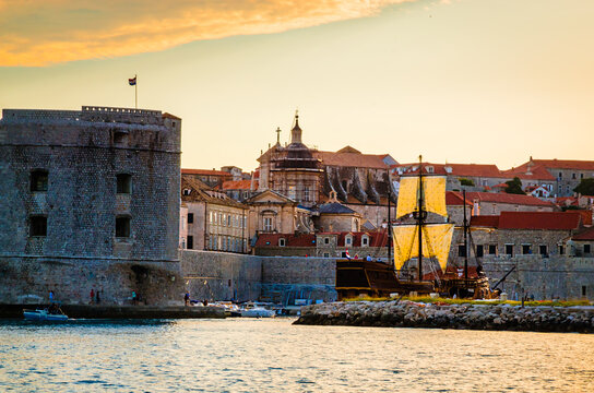 Sunset panoramic view on walls and port of famous old city Dubrovnik, Croatia