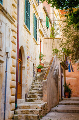 Fototapeta na wymiar Famous narrow street and old city walls in Dubrovnik, Croatia