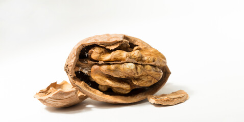 Walnuts are rounded, single-seeded stone fruits of the walnut tree. Cracking a nut.