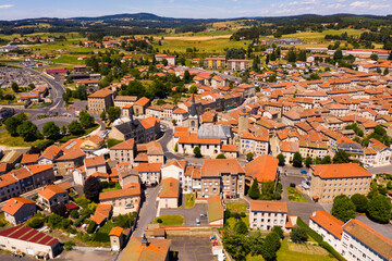 Aerial view of residential areas of French commune of Craponne-sur-Arzon with similar brownish...