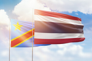 Sunny blue sky and flags of thailand and dr congo