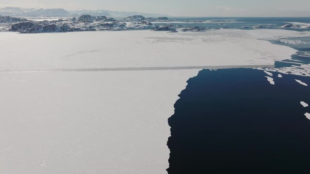Drone Over Ice Coastline And Blue Sea By Sisimiut