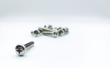 stainless steel phillips screws on white background.