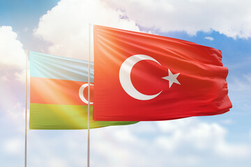 Sunny blue sky and flags of turkey and azerbaijan