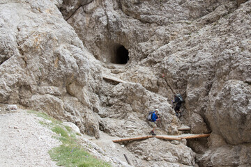 Two tourist on Cengia Martini footpath, Lagazuoi, Italian Alps.
