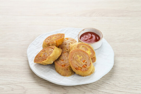 Chicken Egg rolls, made from mixtured minced chicken with tapioca, carrots, scallions and eggs then rolled, steamed and fried

