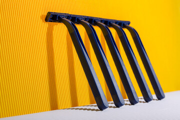 Abstract still life with razors on a colored background