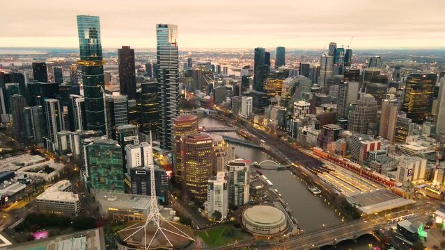 Aerial drone pullback view of Melbourne City, Victoria, Australia above Yarra River in the early morning 