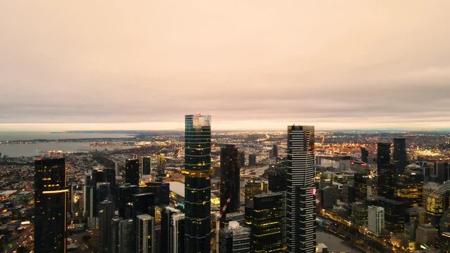 Aerial drone view of Melbourne City Victoria, Australia heading in the direction of Port Phillip looking over Yarra River in the early morning 