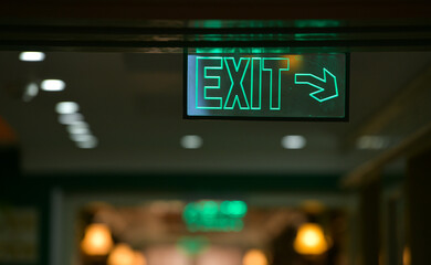 Emergency exit sign on the hallway of a hotel