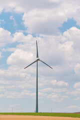 Fototapeta premium Wind power plant on the hills from Dobrogea, Romania. Landscape with wind turbines. Green energy industry.