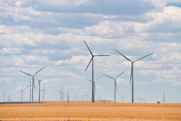 Wind power plant on the hills from Dobrogea, Romania. Landscape with wind turbines. Green energy...