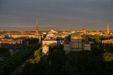 Amazing summer sunrise over the central district of Riga, with view to Freedom Monument, Old town and Cathedral. Landmarks of Latvia.