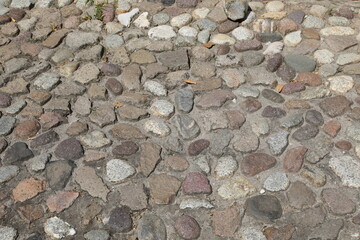 road pavement made of pebbles and stones of various sizes