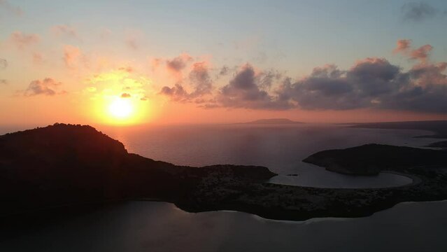 Panoramic aerial view of voidokilia beach, one of the best beaches in Europe. Beautiful lagoon of Voidokilia from a high point of view at sunset in Messinia, Greece, Europe