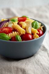 Homemade Fusilli Pasta Salad with Mozzarella and Vegetables, low angle view.