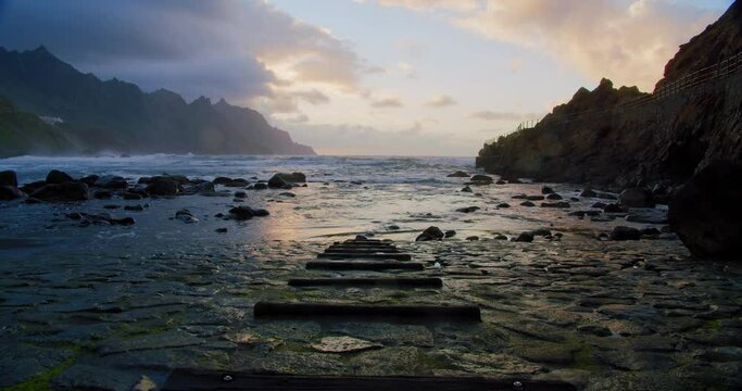 Relaxation on the promenade of Benijo beach, playa de Benijo, near to Almaciga village. Guide lines to the ocean. Big waves break on the rocks. Nobody. Peace and quiet.