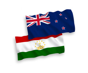 National vector fabric wave flags of New Zealand and Tajikistan isolated on white background. 1 to 2 proportion.