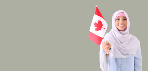 Young Muslim woman with Canadian flag on grey background with space for text