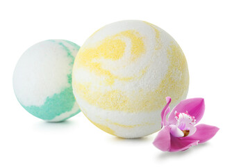 Bath bombs and orchid flower on white background
