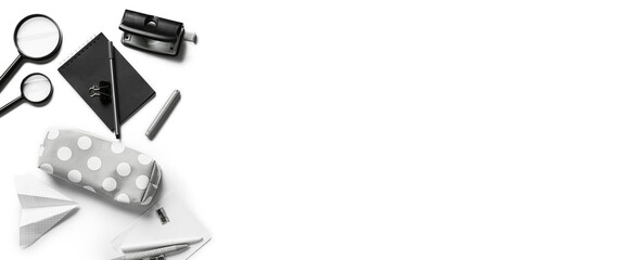 Pencil case with set of school supplies isolated on white