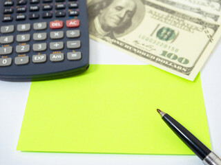 Closeup paper on workplace,Top view calculator money and noted