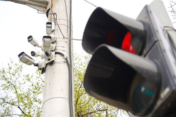 Almaty, Kazakhstan - 04.12.2022 : CCTV cameras on a pole at a traffic intersection.