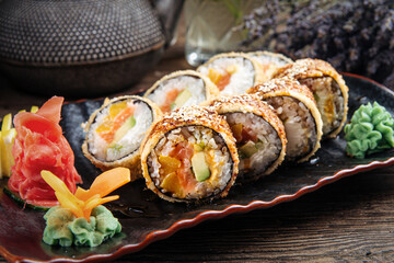 Closeup on portion of appetizing deep fried sushi rolls
