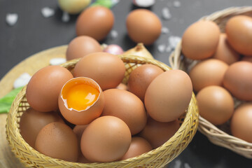 Eggs that have been peeled and saw fresh yolks are placed in a basket full of eggs. and chicken eggs in egg panels