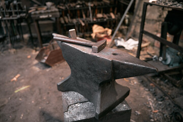 Traditional blacksmiths hardware and instruments. Concept of working in the workshop. Close up details of tools that were used to work with iron, weapons, and armor.