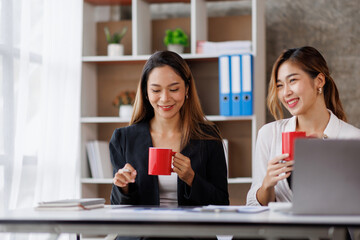 Cropped shot of Asian Business woman diverse coworkers working together in the boardroom, brainstorming, discussing, and analyzing business report strategy collaboration.