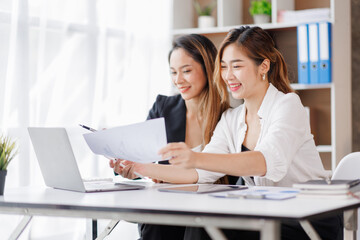 Cropped shot of Asian Business woman diverse coworkers working together in the boardroom, brainstorming, discussing, and analyzing business report strategy collaboration.