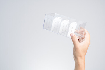 Hand holding plastic divider partition box for office or home user