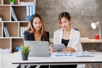 Cropped shot of Asian Business woman diverse coworkers working together in the boardroom, brainstorming, discussing, and analyzing business report strategy collaboration.