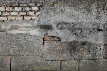 old brick wall background with damaged and cracked cement surface, space for text, 