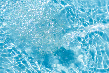 Bright blue water is reflected in the sun. Background