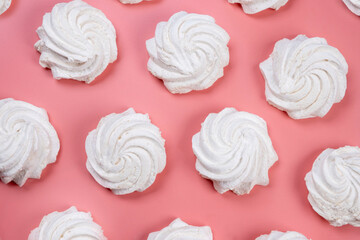  background of marshmallows or cakes, birthday cakes on a pink background. The concept of celebrating a party, anniversary in pink colors