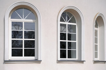 Beautiful arched windows in building, view from outdoors