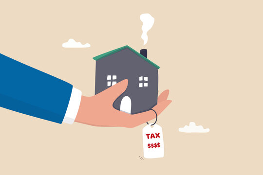 Property tax, real estate or housing payment, money or bills to pay for government concept, businessman hand holding house with the price tags showing property tax with dollar signs to pay for.