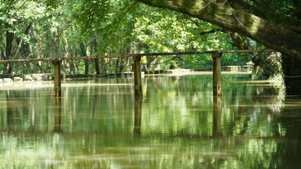 One old wooden bridge cross the river in the village of the China