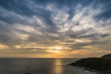 Naklejka na ściany i meble The sun is falling in sunset time at Promthep Cape in Phuket, Thailand.
