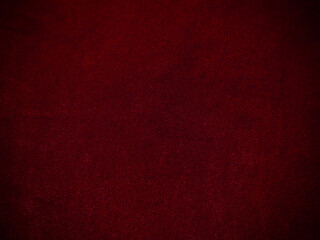 Dark red velvet fabric texture used as background. Empty red fabric background of soft and smooth textile material. There is space for text.