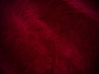 Dark red velvet fabric texture used as background. Empty red fabric background of soft and smooth textile material. There is space for text.