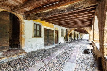 Fototapeta na wymiar Interior of the historic arcaded street of Averara