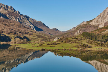Beautiful reservoir and mountain landscape in Riano. Mirror effect. Spain