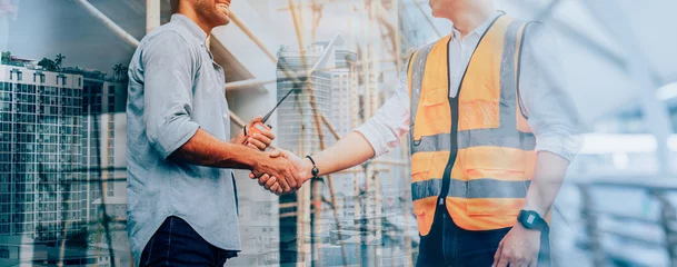 Foto op Plexiglas Engineer construction workers shaking hands with deals on construction site, success collaboration concept, banner cover design. © kelvn