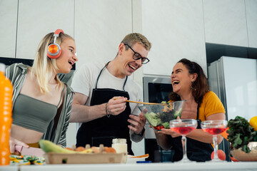 Happy family cooking together on kitchen with kids, Home recreation and food preparation on weekend.