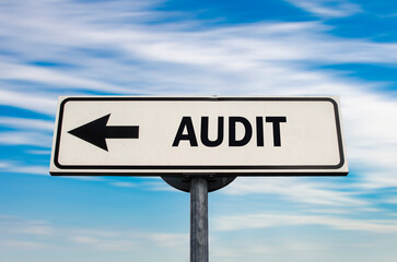 Audit arrow road sign on blue sky